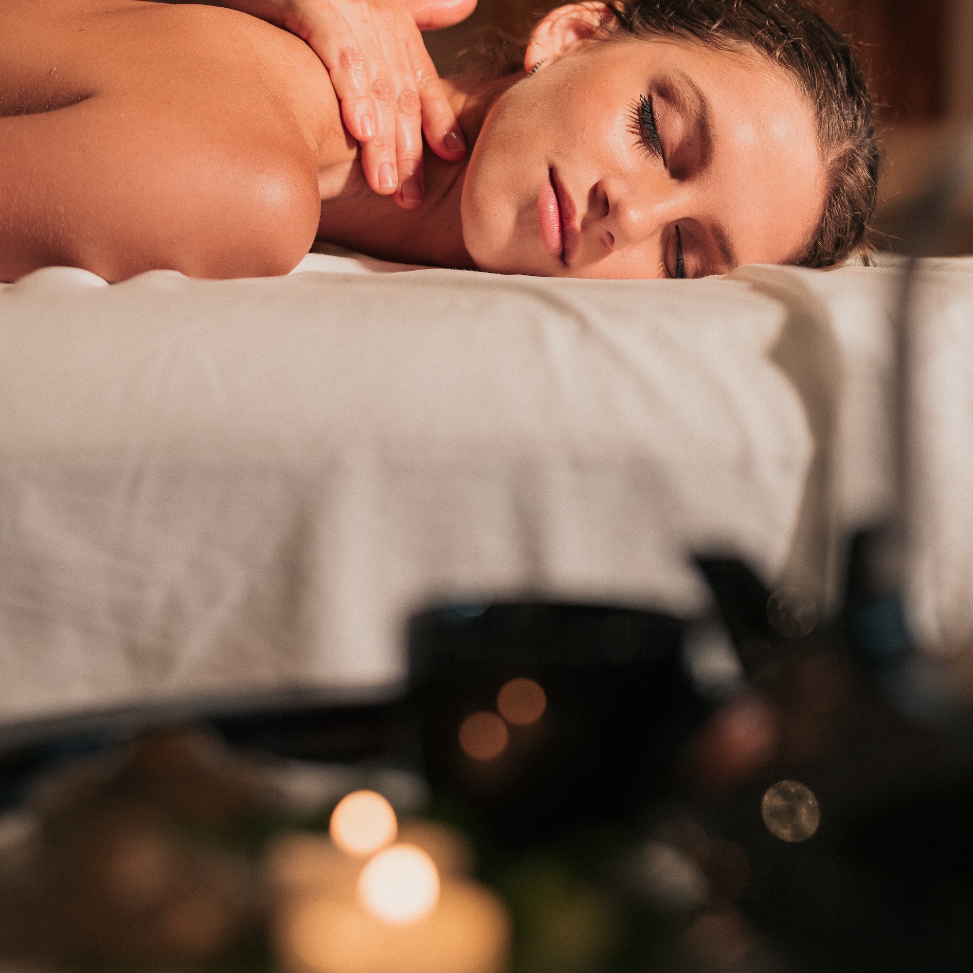 a woman lying on a massage table