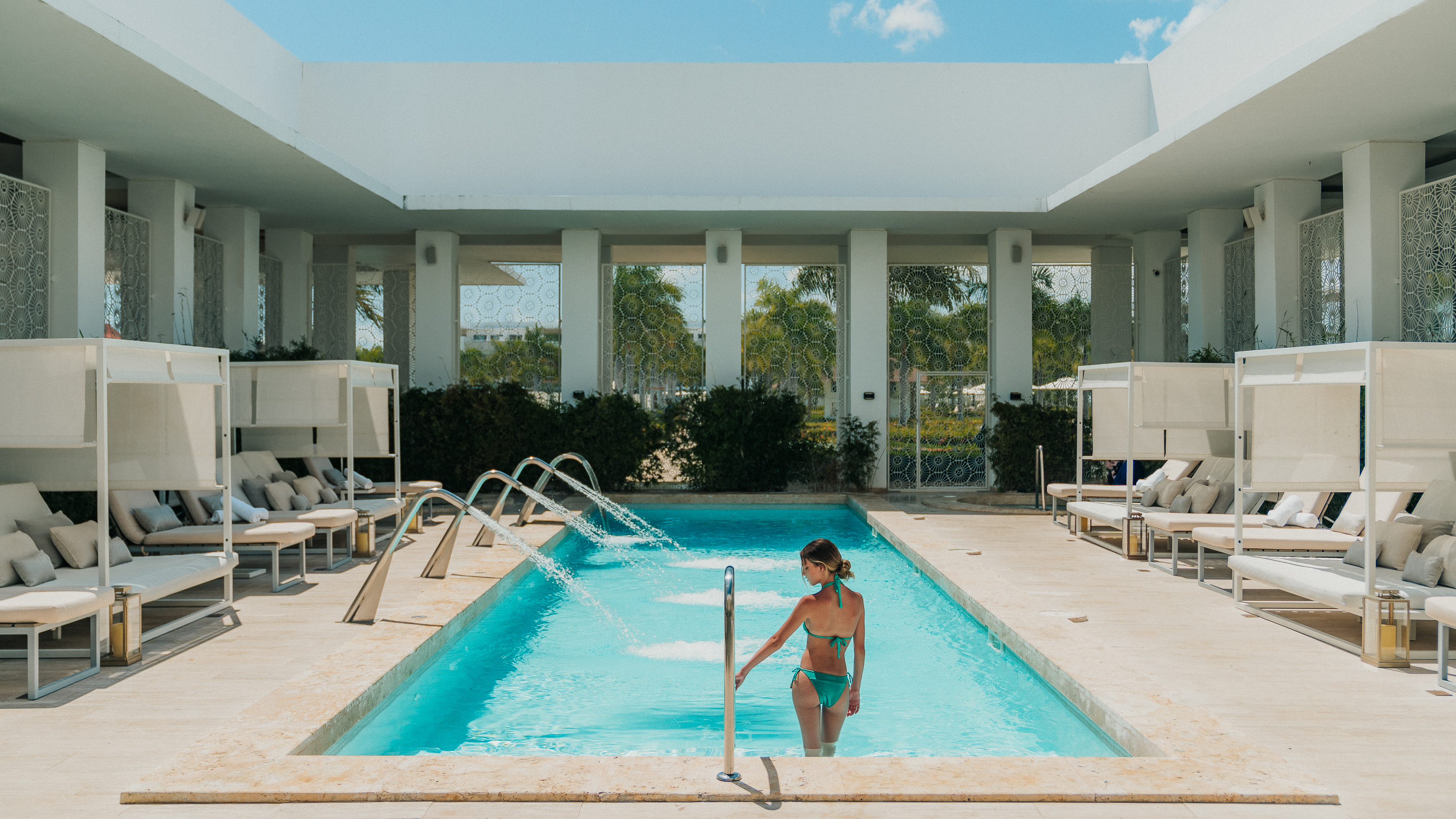 a woman in a garment in a pool