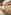 Hotel restaurant breakfast buffet with pastries, bread, and juices.