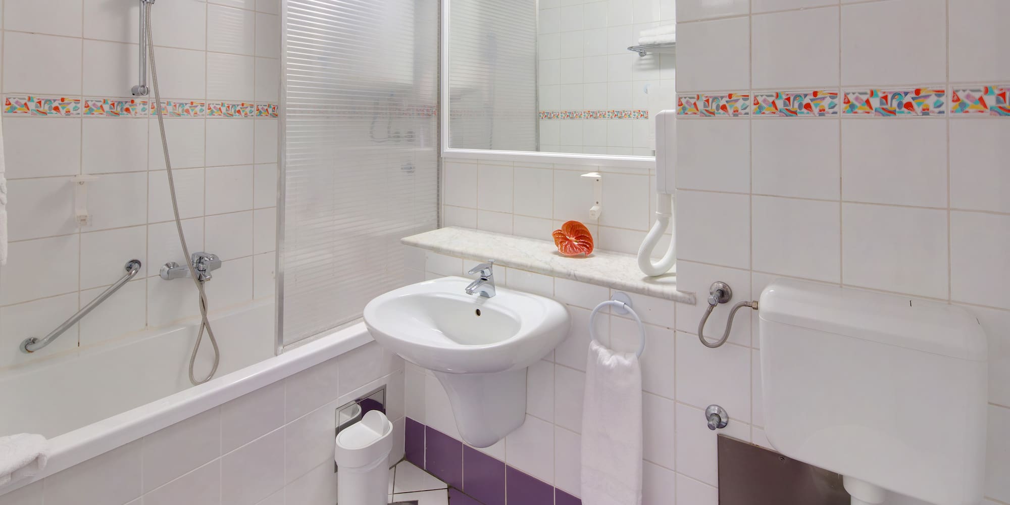 a bathroom with a sink and toilet
