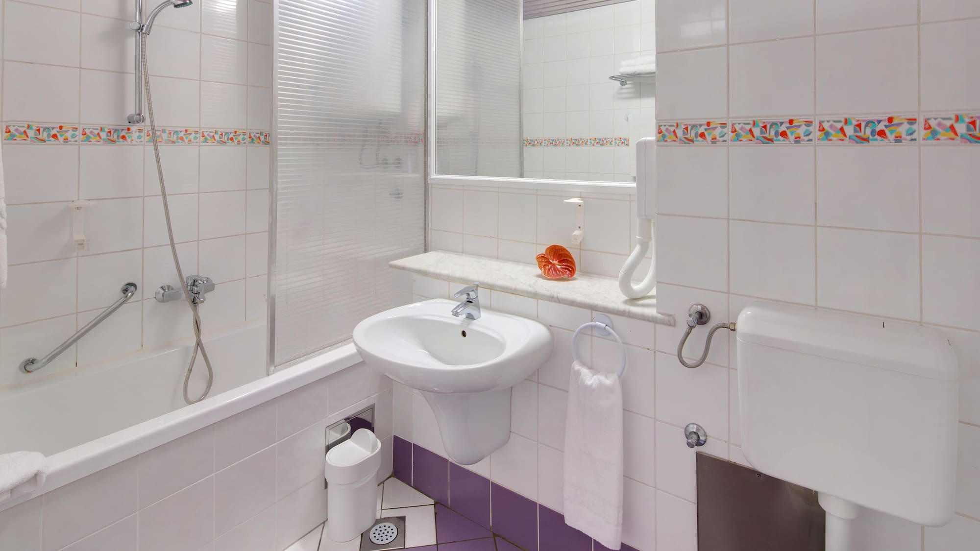 a bathroom with a sink and toilet