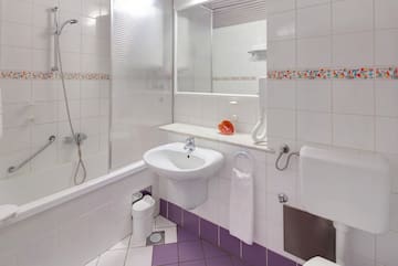 a bathroom with a sink and toilet