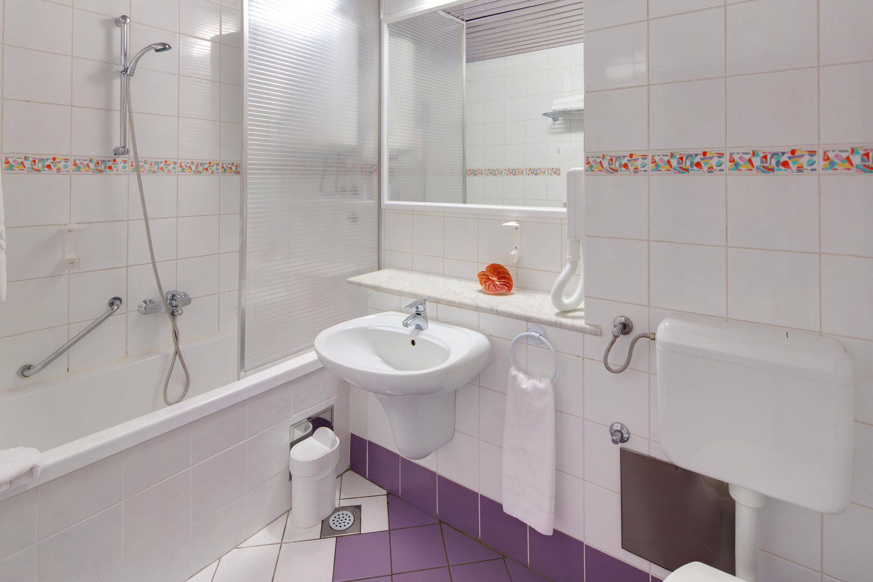 a bathroom with a sink and toilet