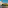 Balcony view of a hotel resort with palm trees, hills, and blue sky.