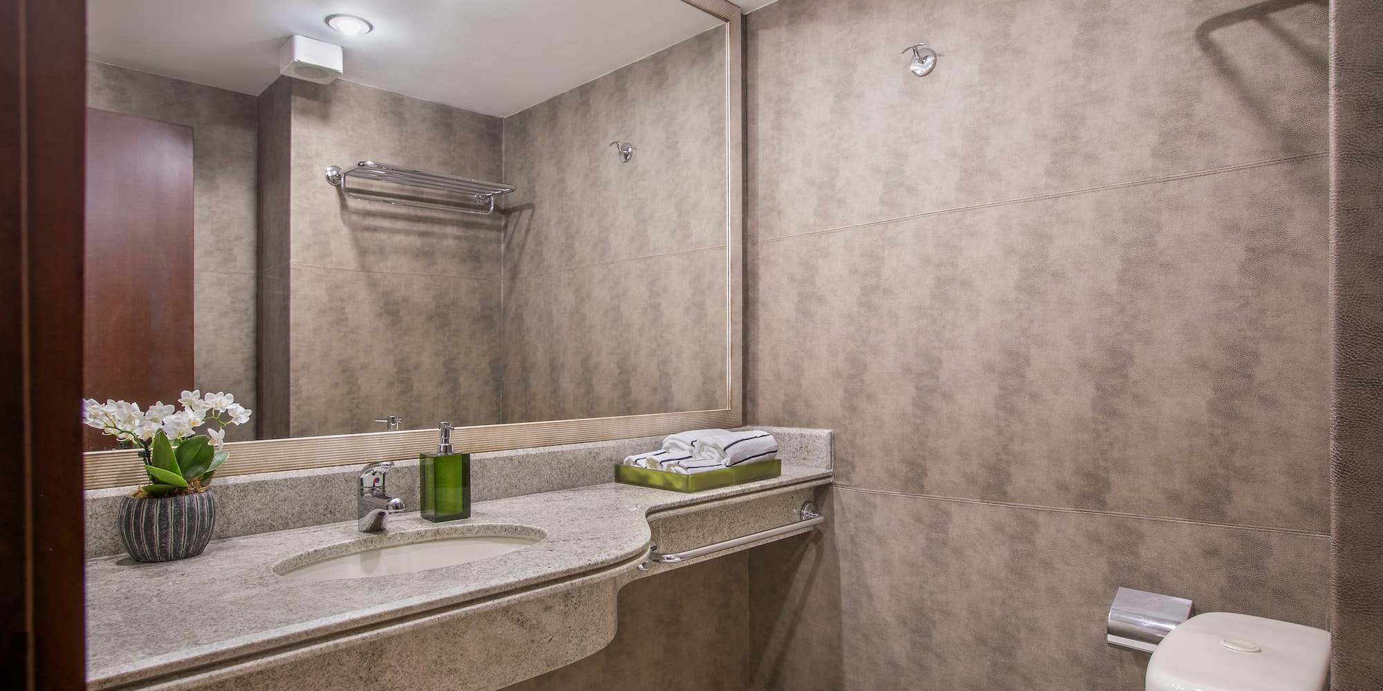 a bathroom with a sink and toilet