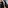 a person measuring a suit