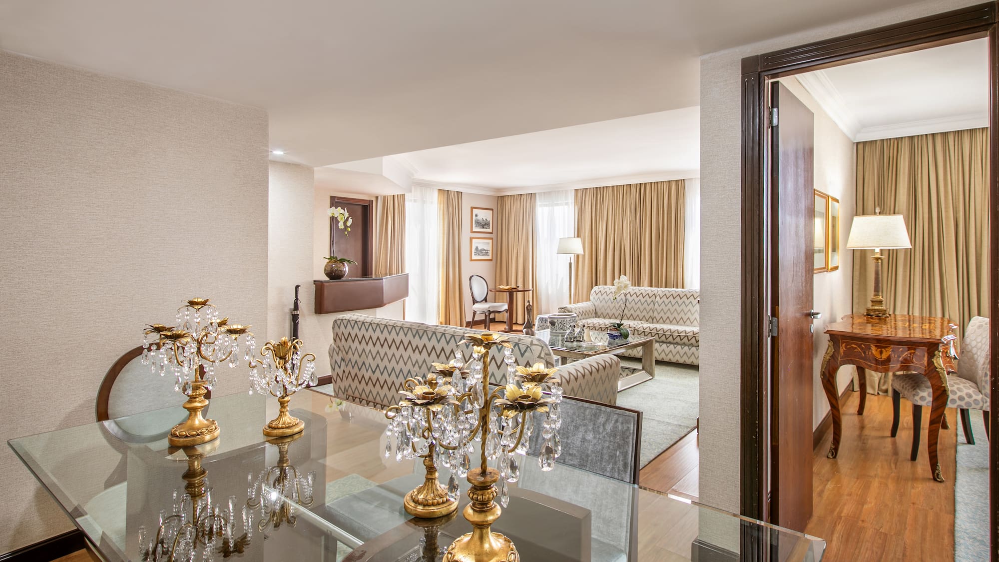 a room with a glass table and a couch