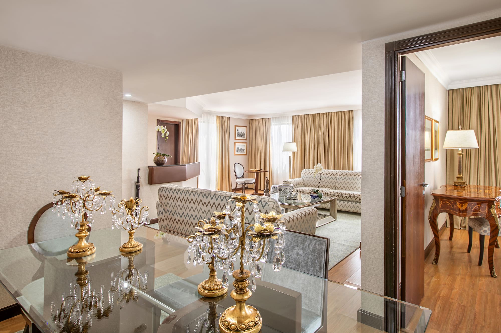 a room with a glass table and a couch