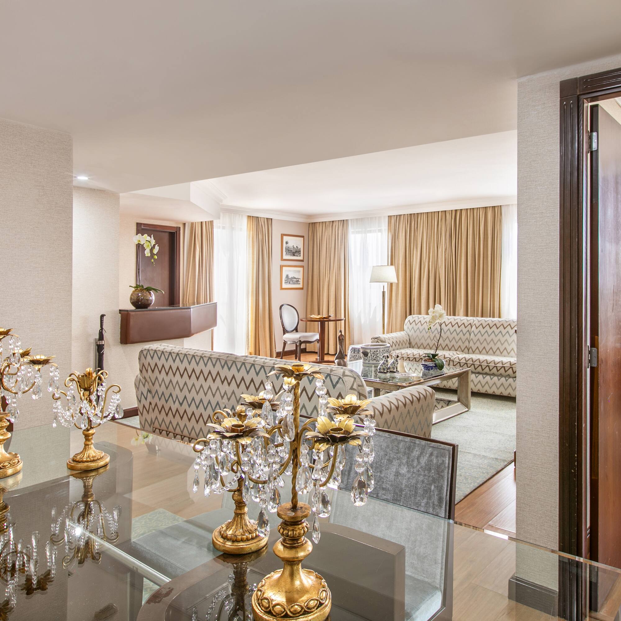 a room with a glass table and a couch