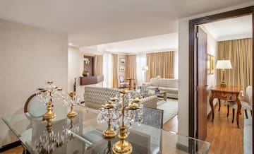 a room with a glass table and a couch