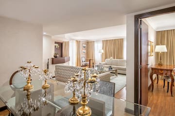 a room with a glass table and a couch