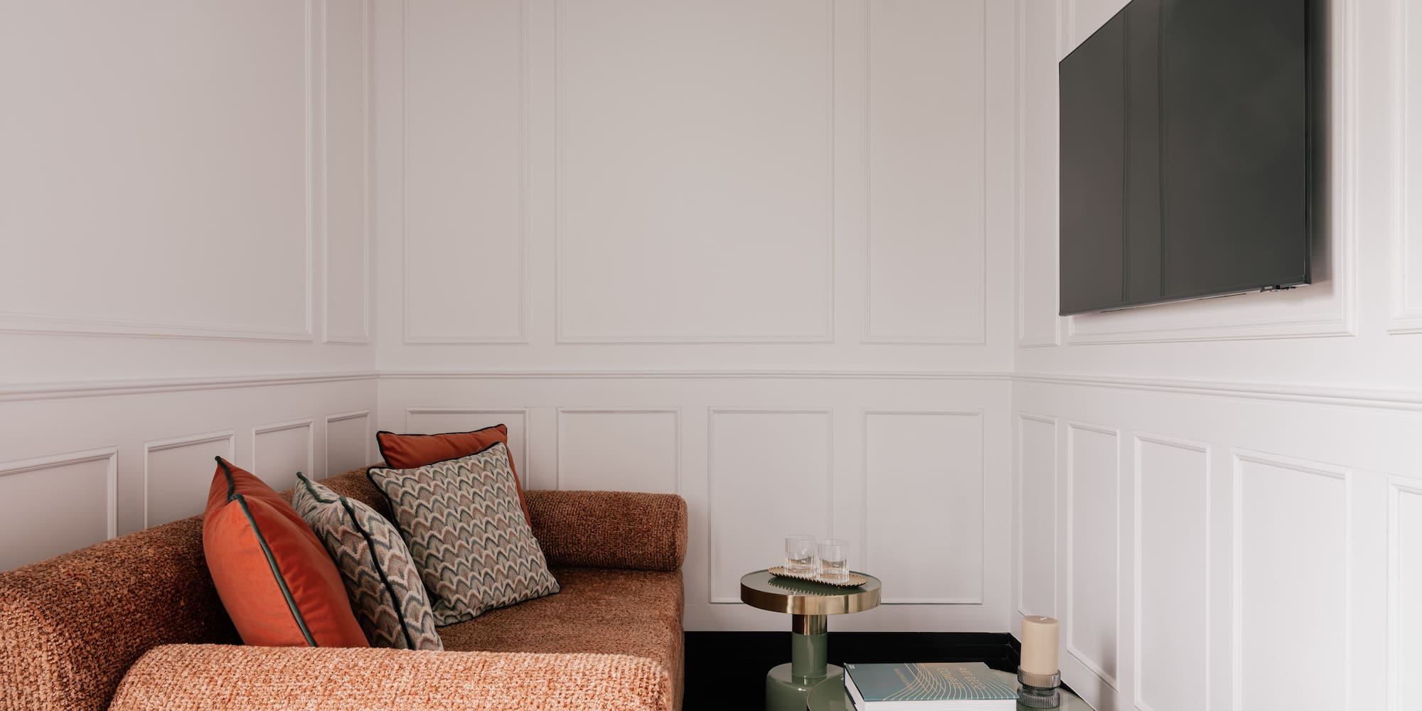 a bedroom with a bed and a bed bench