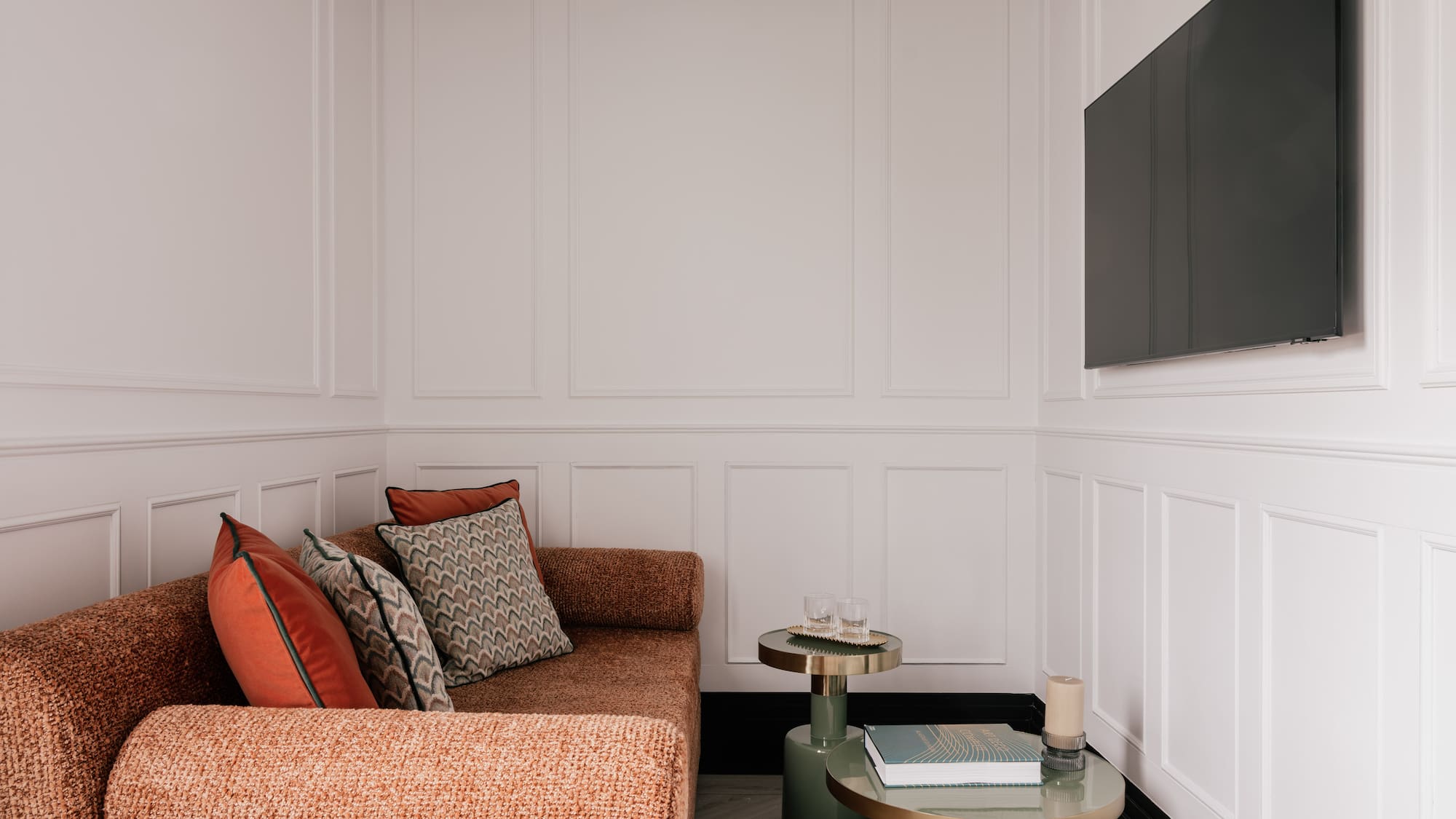 a bedroom with a bed and a bed bench