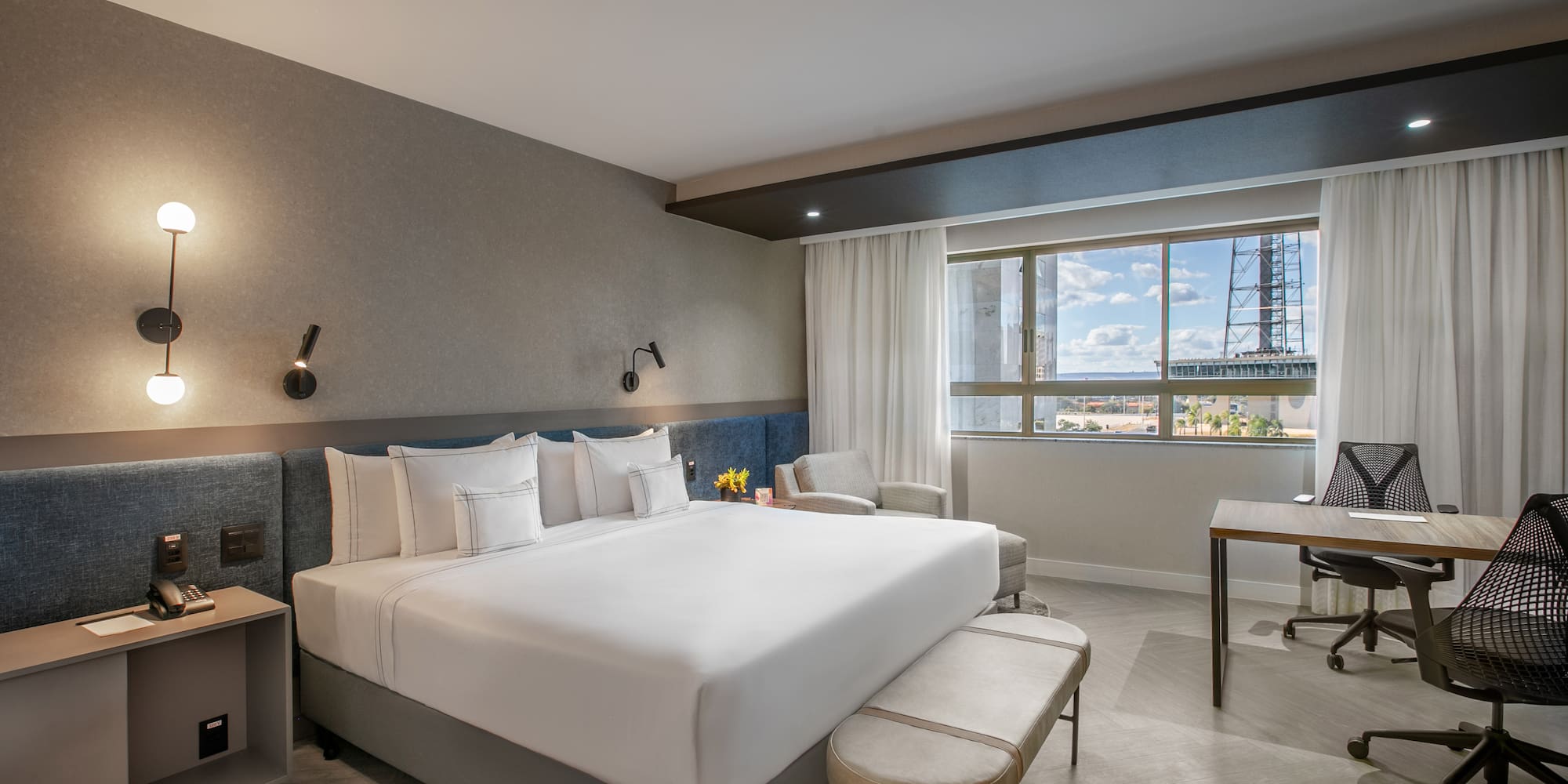 a room with a bed and a desk