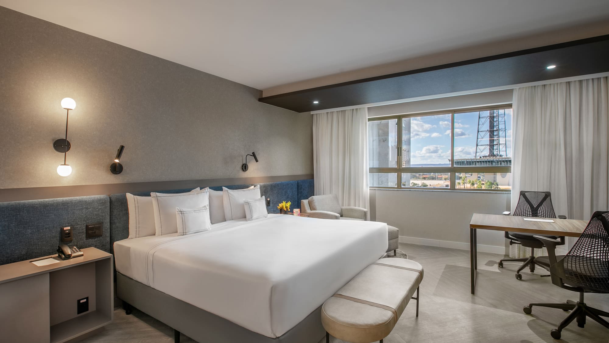 a room with a bed and a desk