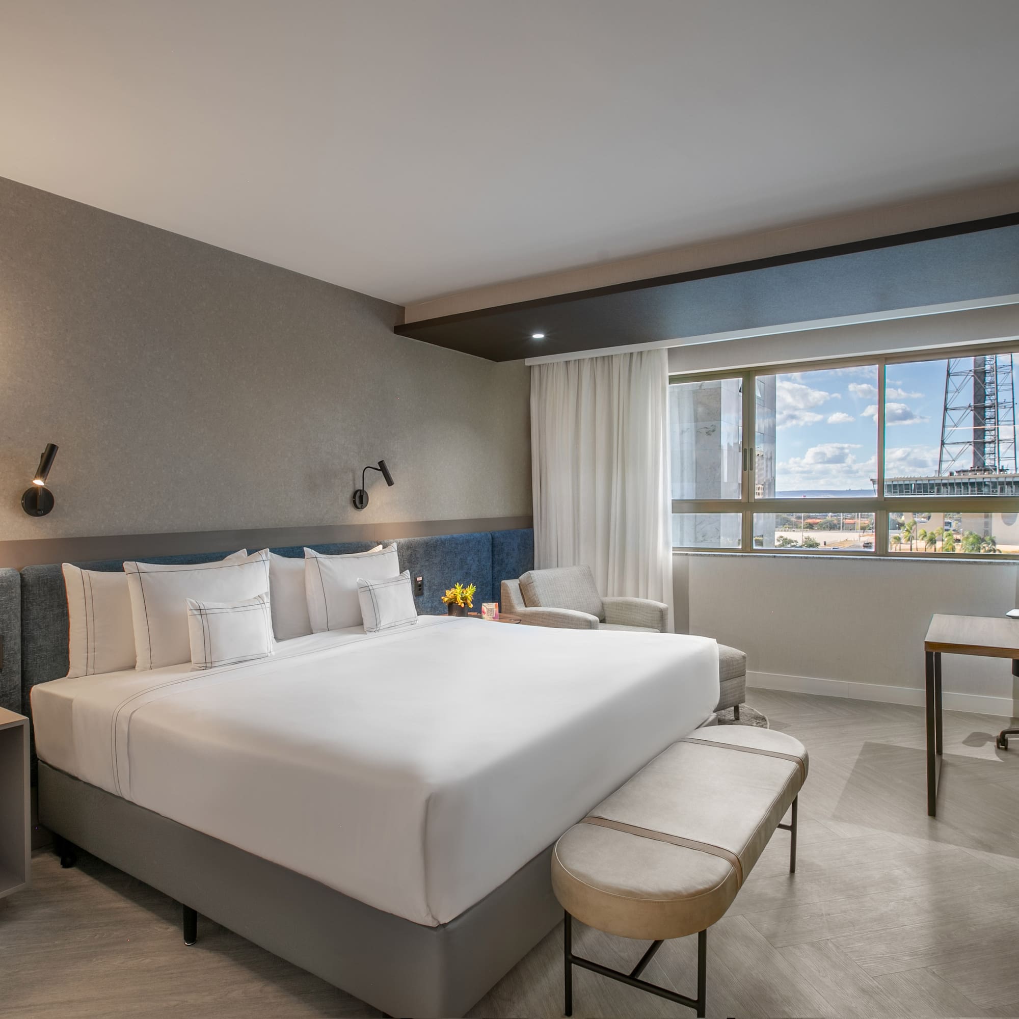 a room with a bed and a desk