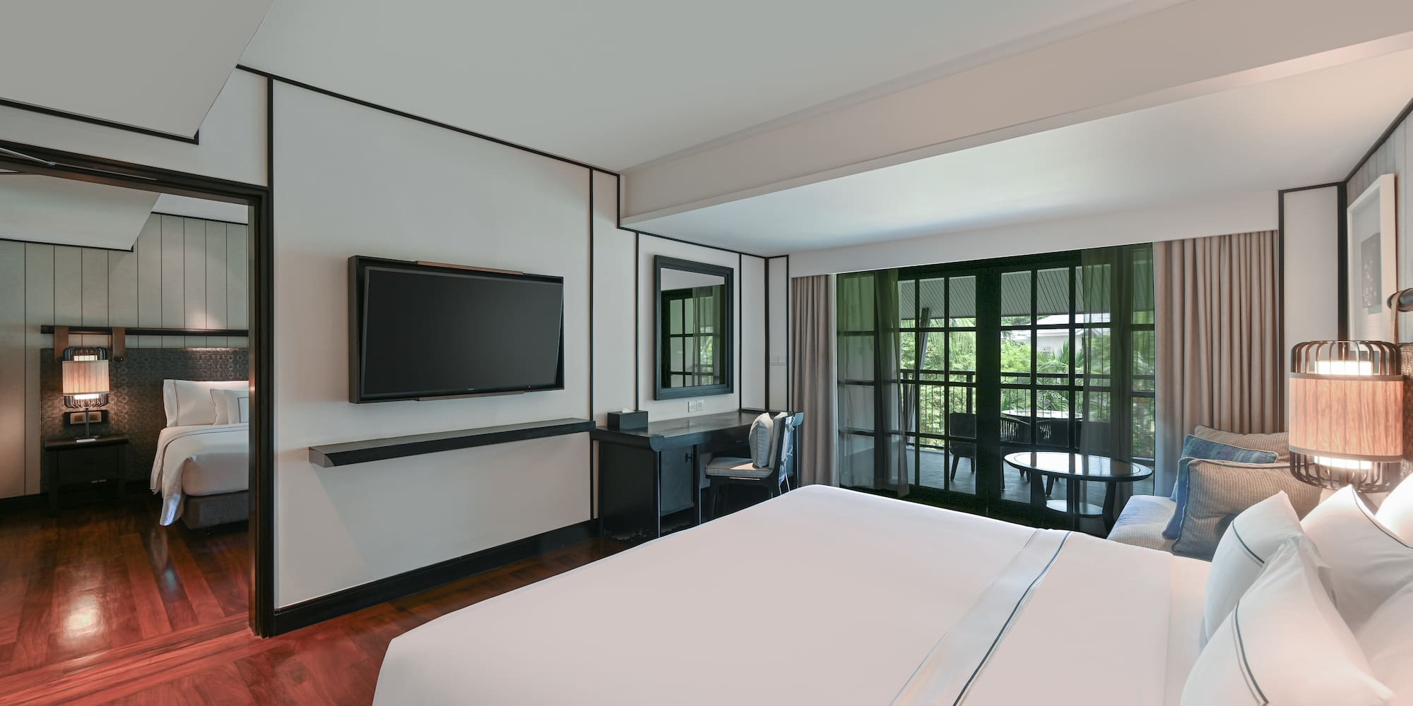 a room with a bed and a television