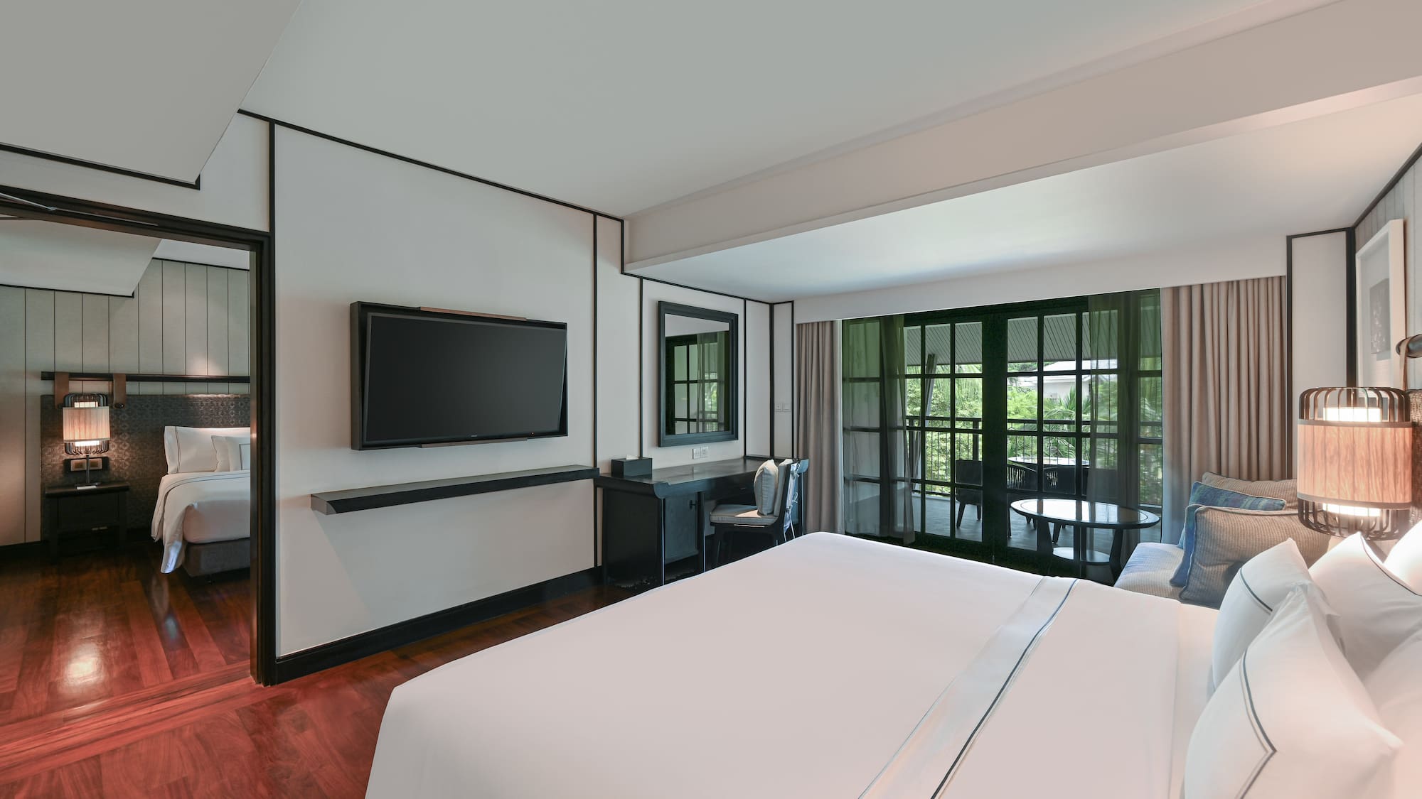 a room with a bed and a television