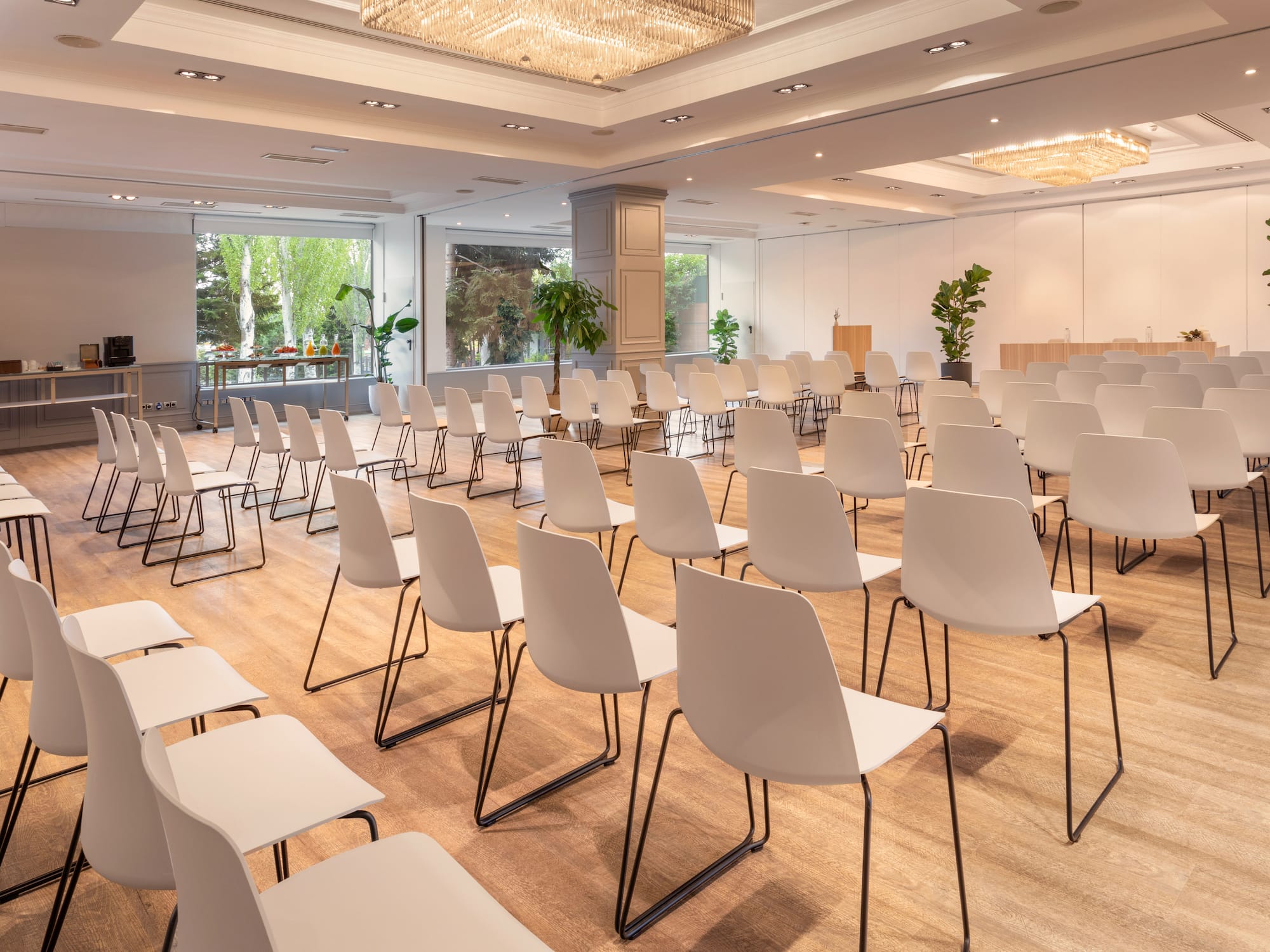 a room with many white chairs