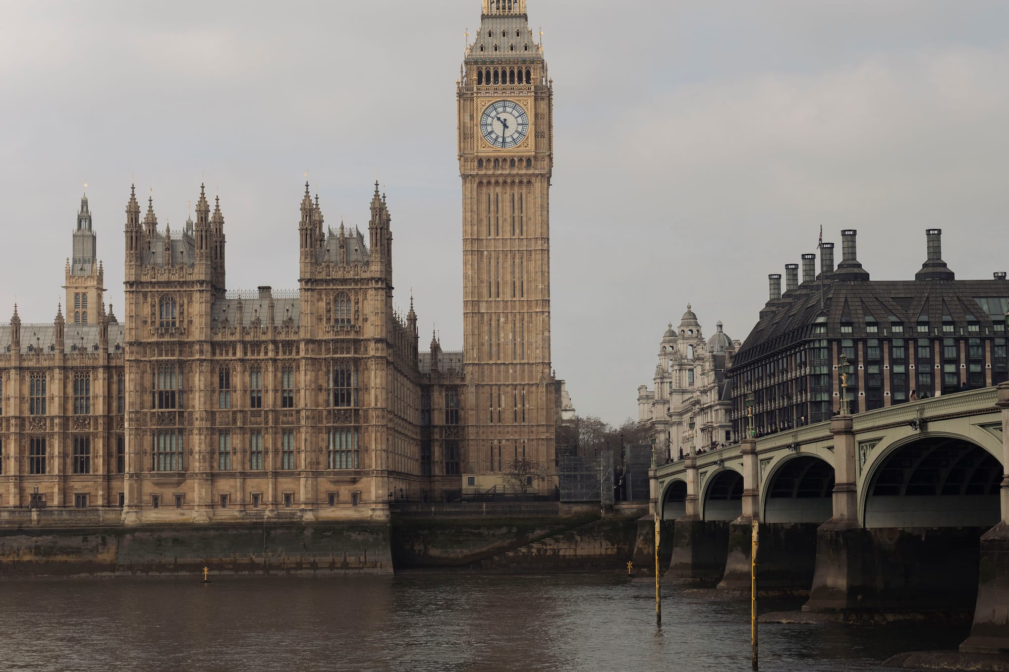 Big Ben, Houses of Parliament, and Westminster Bridge over River Thames, London.
