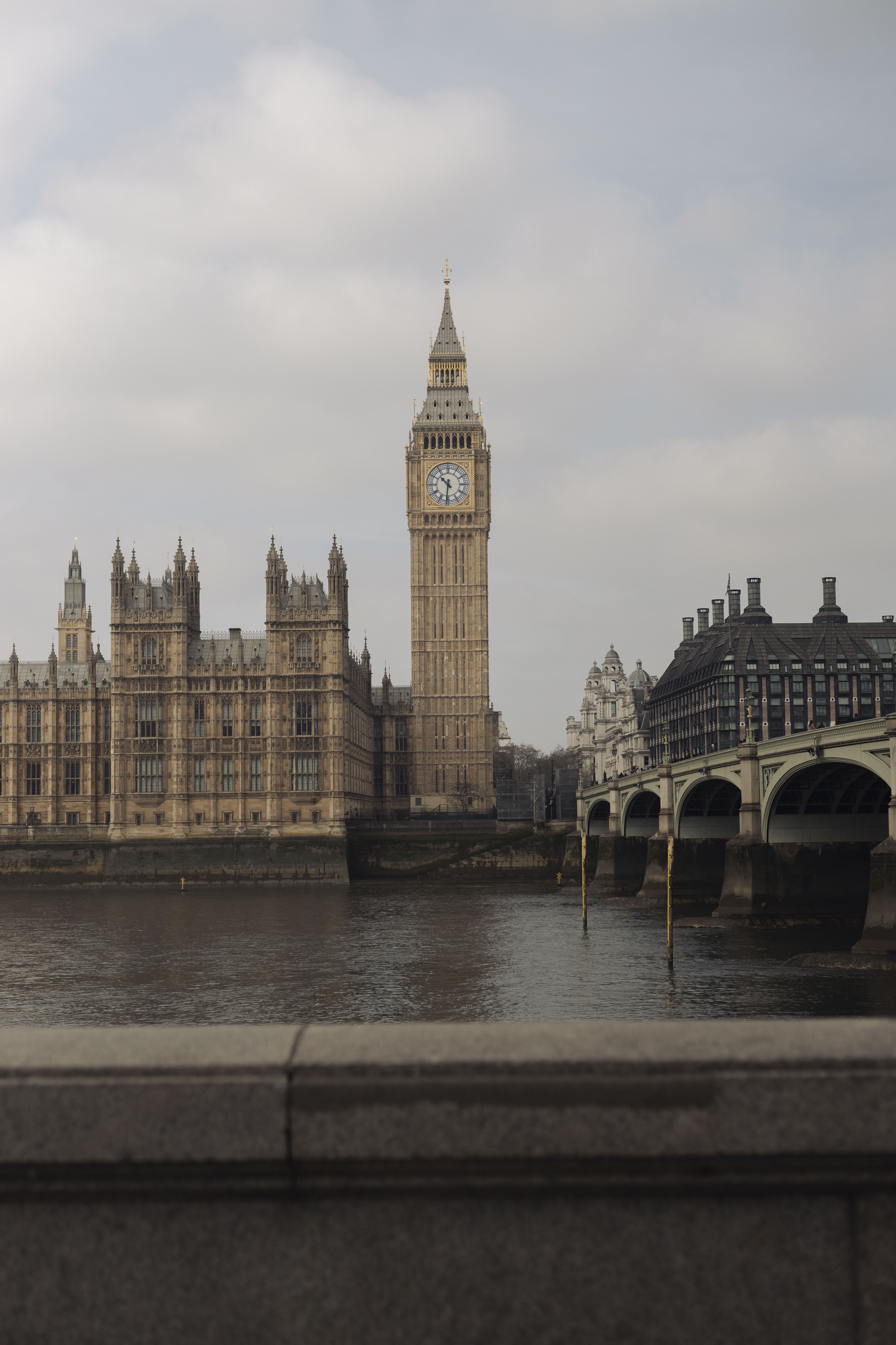 Big Ben, Houses of Parliament, and Westminster Bridge over River Thames, London.