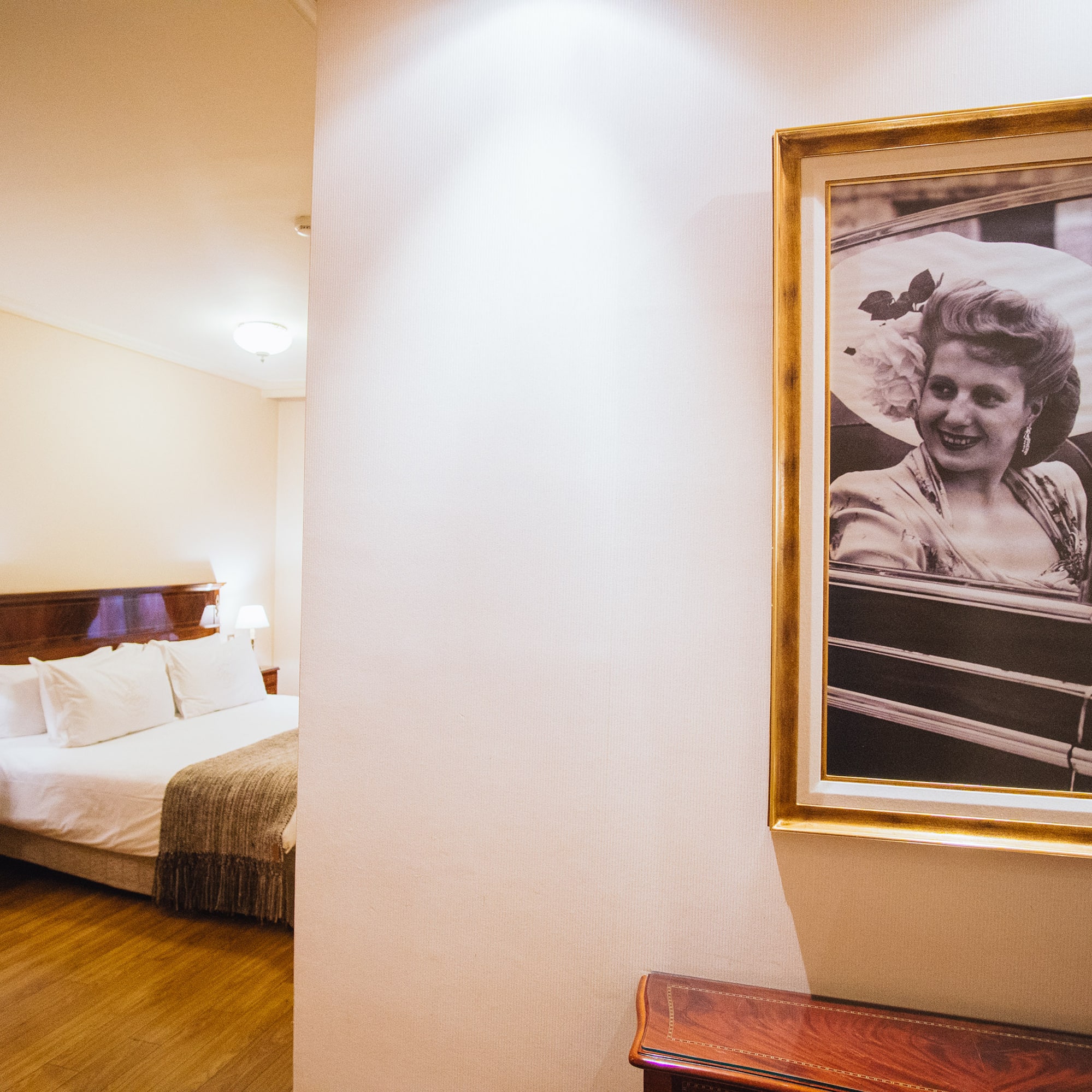 a picture of a woman in a frame on a wall