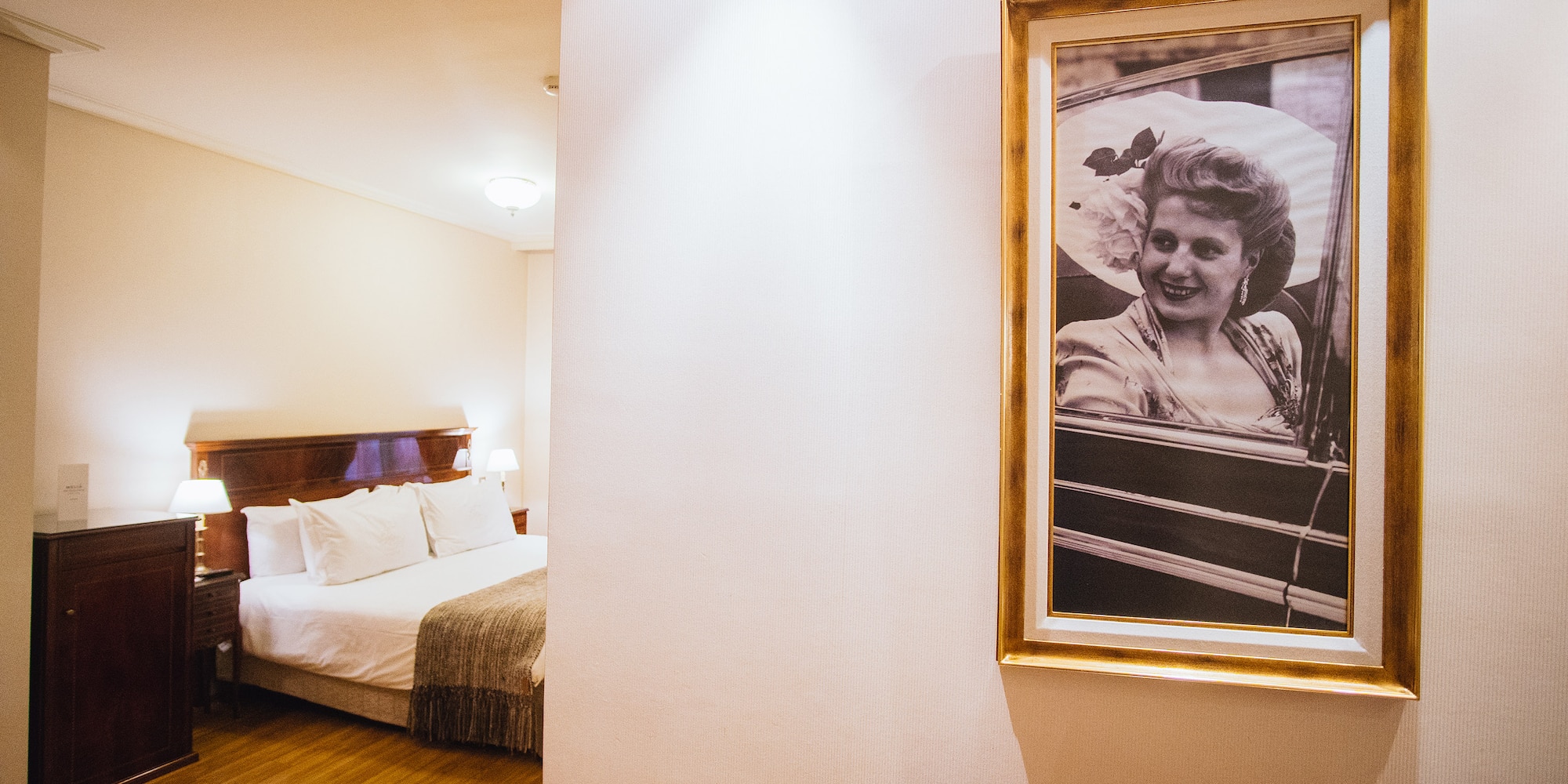 a picture of a woman in a frame on a wall