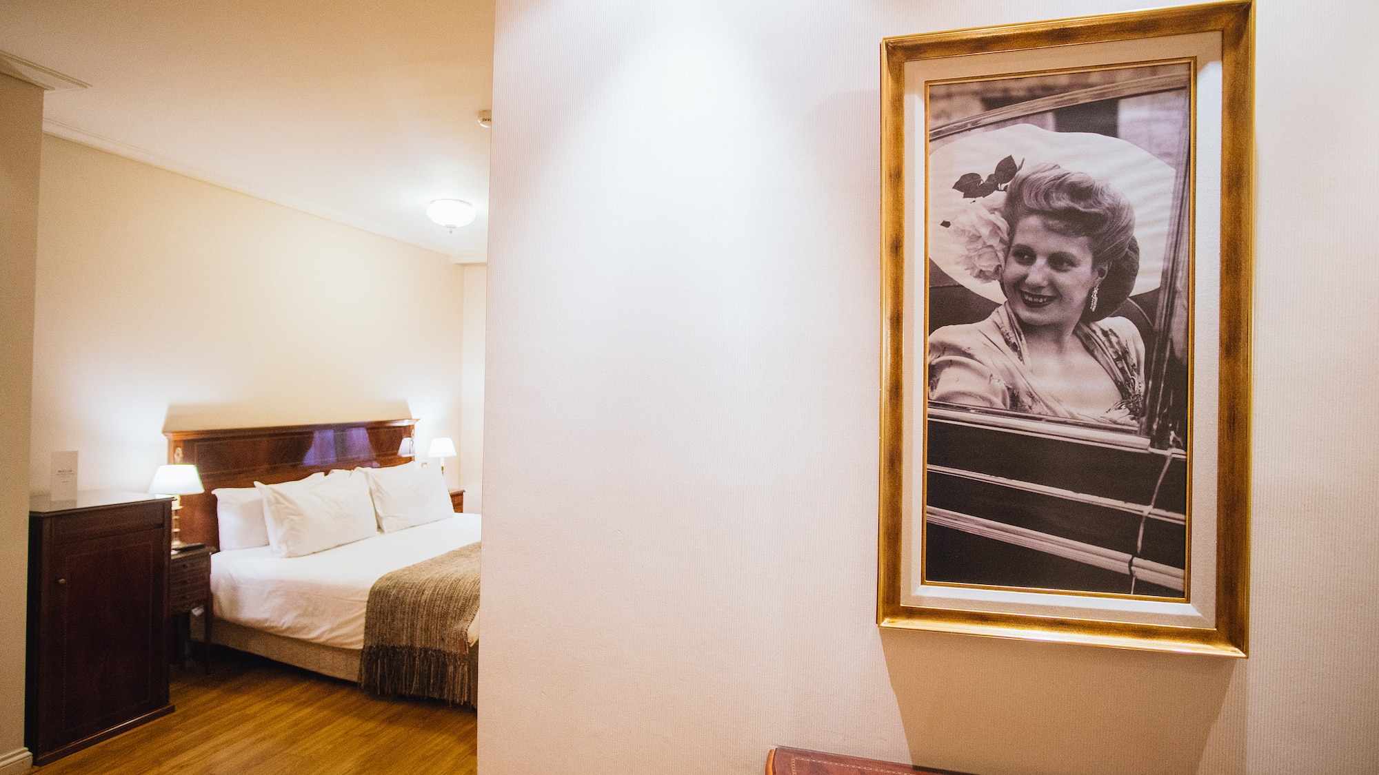 a picture of a woman in a frame on a wall