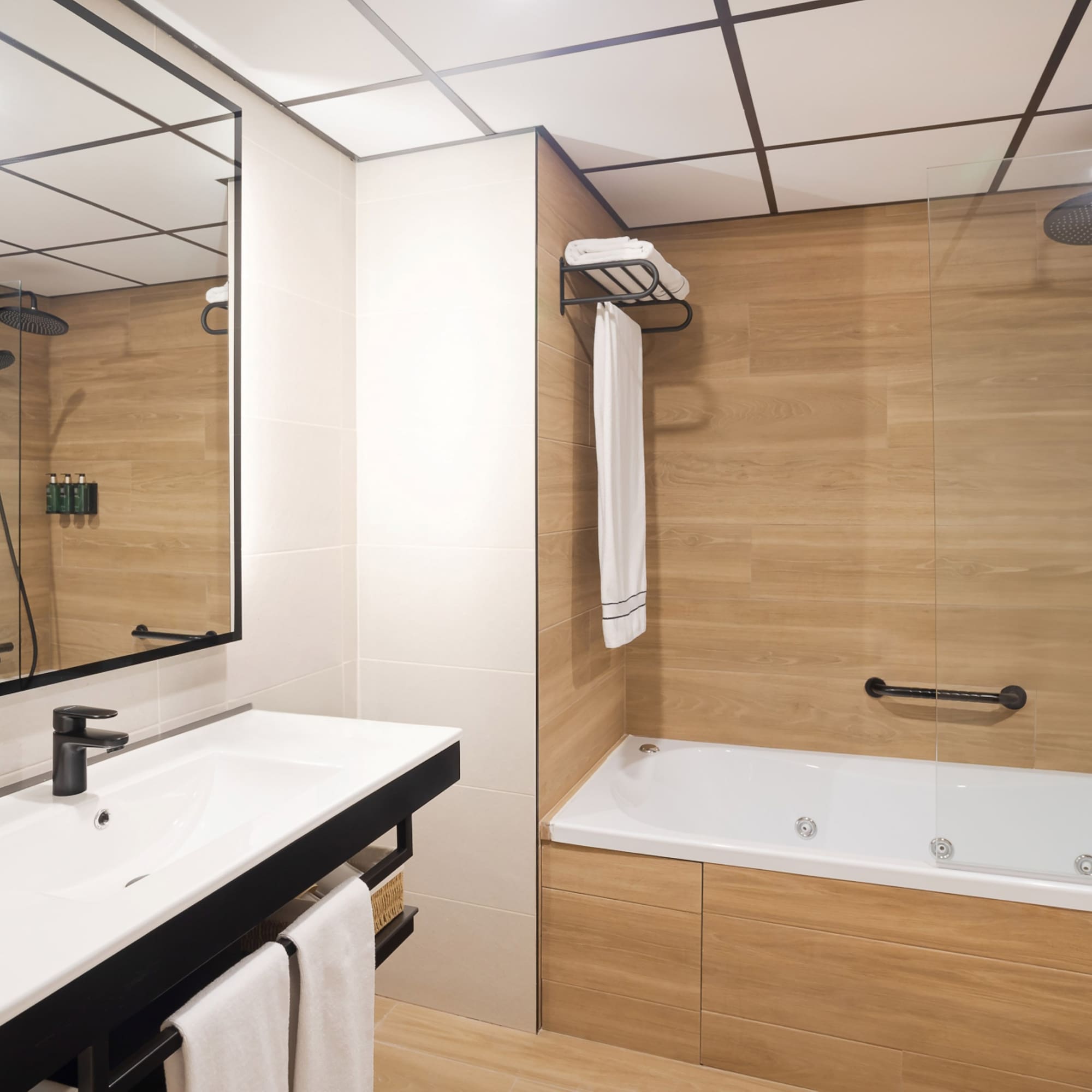 a bathroom with a bathtub and shower