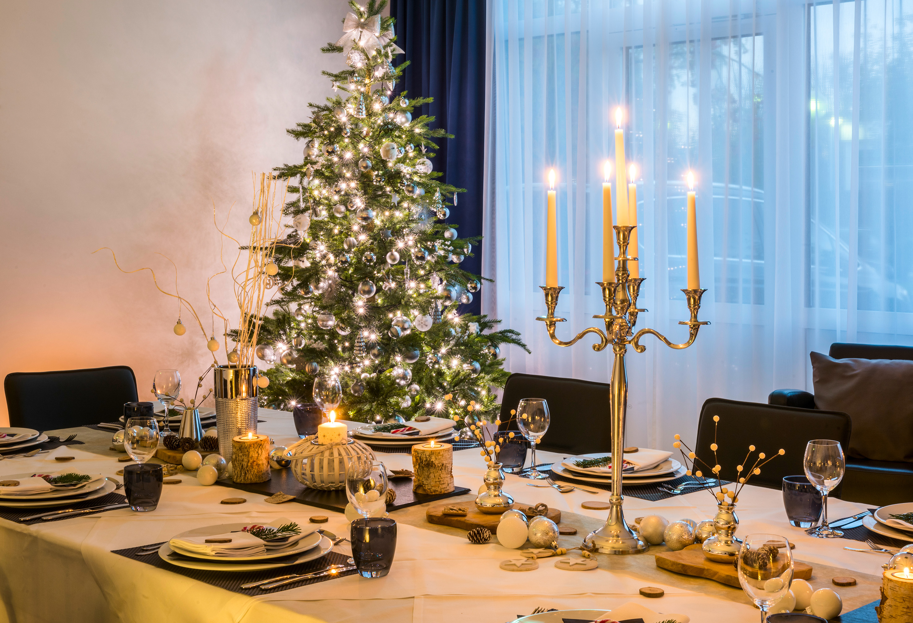 a christmas tree with candles on a table