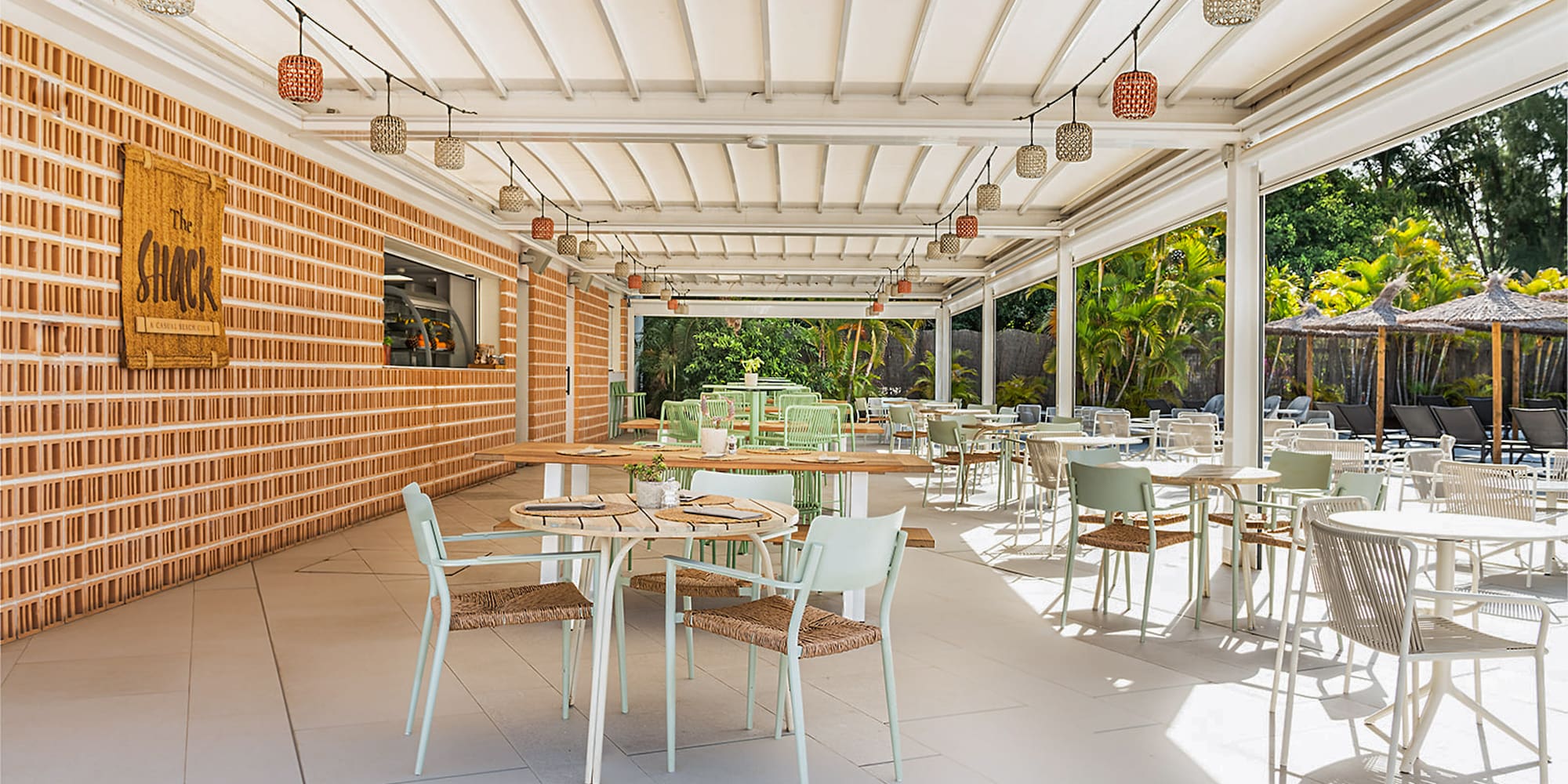 a patio with tables and chairs