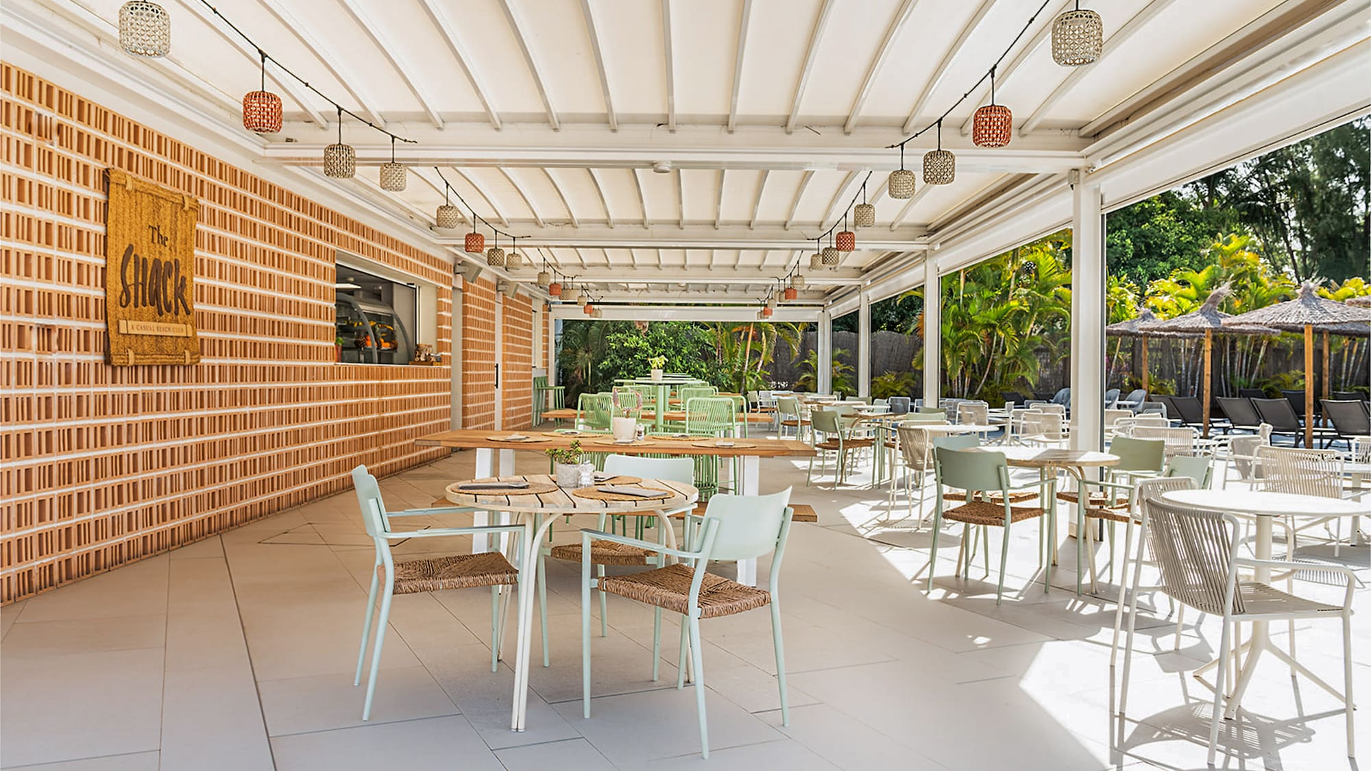a patio with tables and chairs