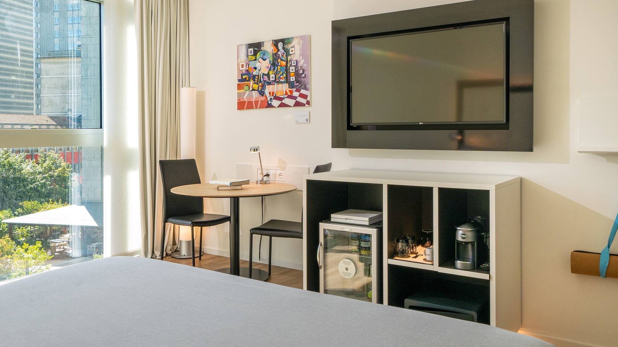 a room with a tv on the wall