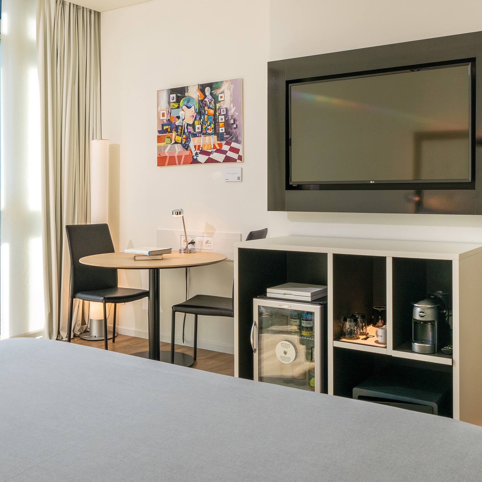 a room with a tv on the wall