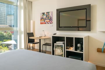 a room with a tv on the wall