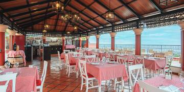 a restaurant with tables and chairs