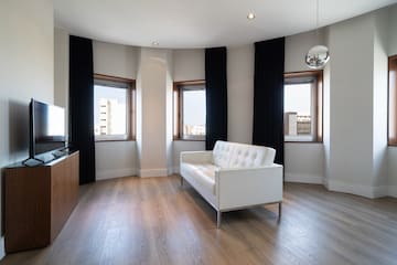 a room with a couch and windows