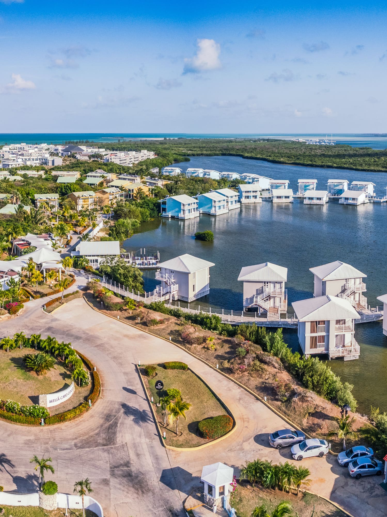 a aerial view of a body of water with houses and boats
