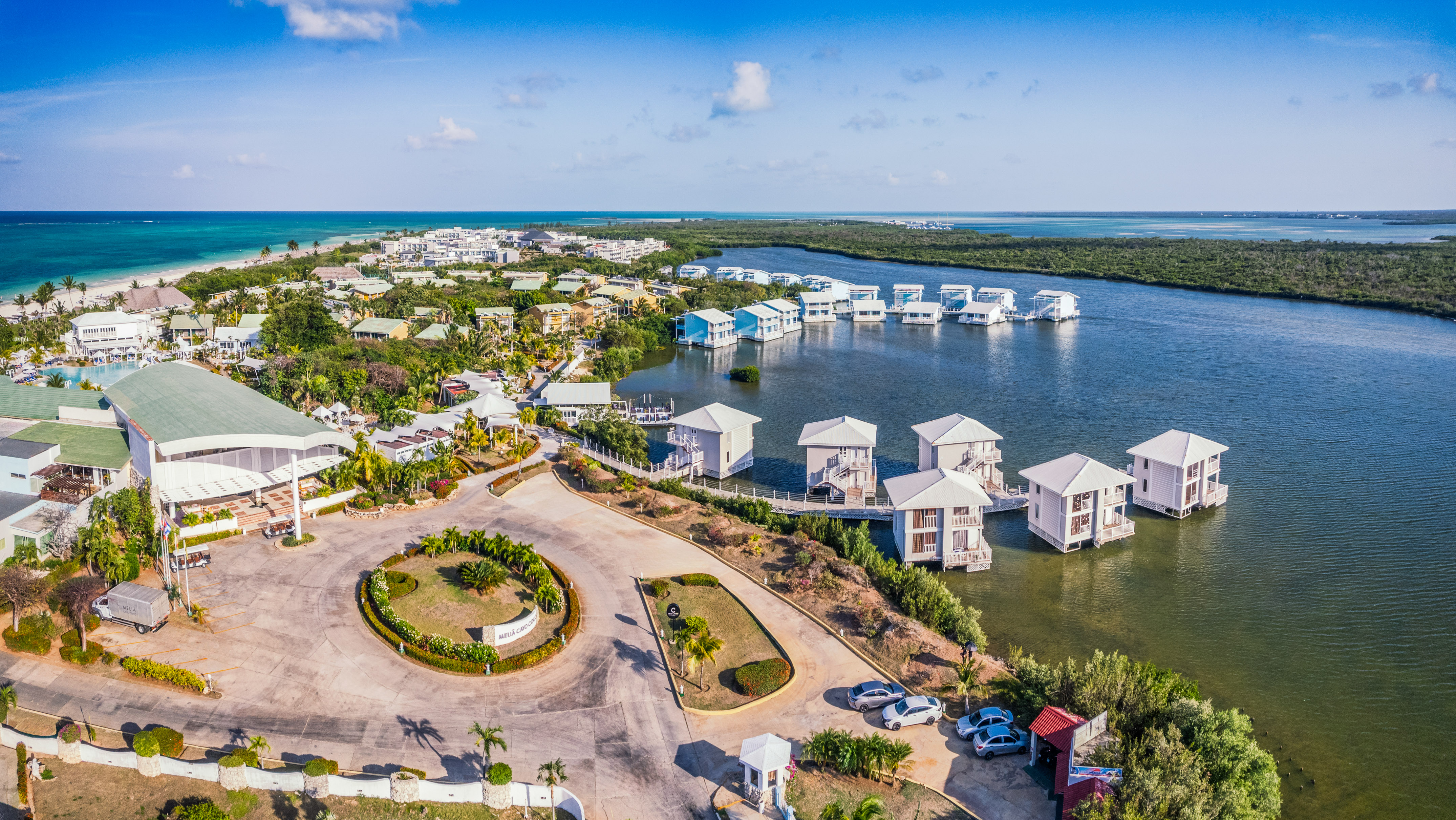a aerial view of a body of water with houses and boats