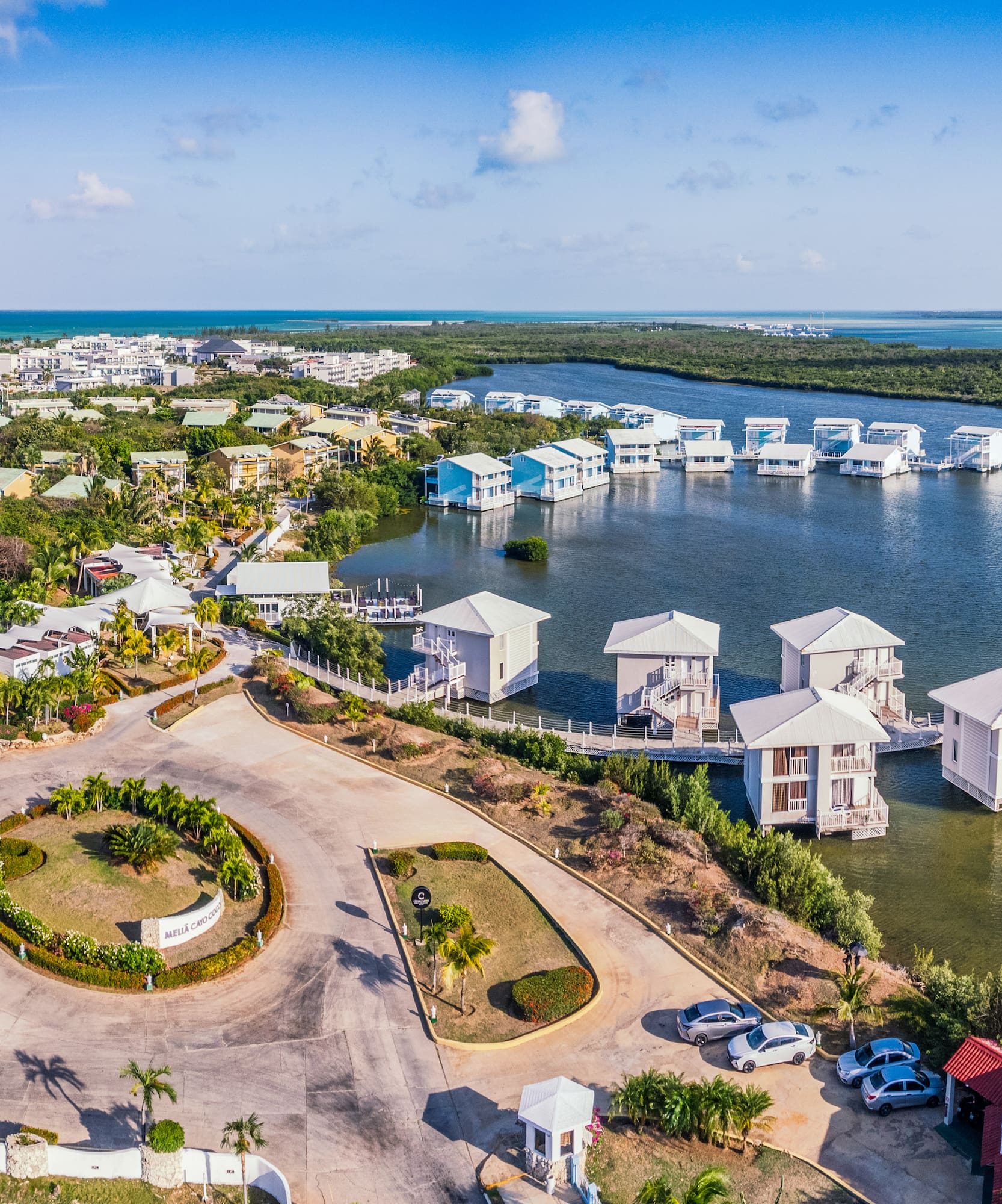 a aerial view of a body of water with houses and boats