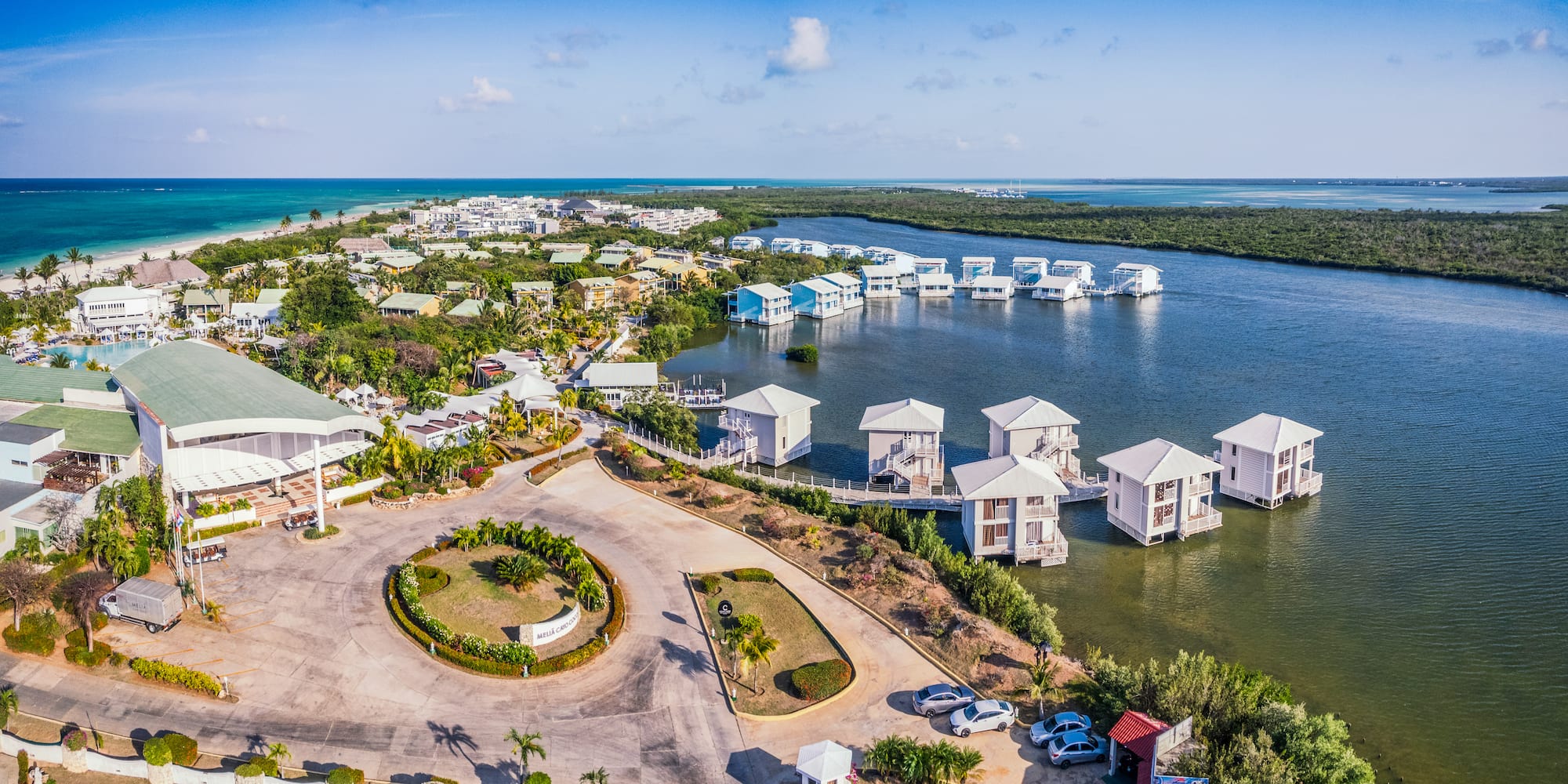 a aerial view of a body of water with houses and boats