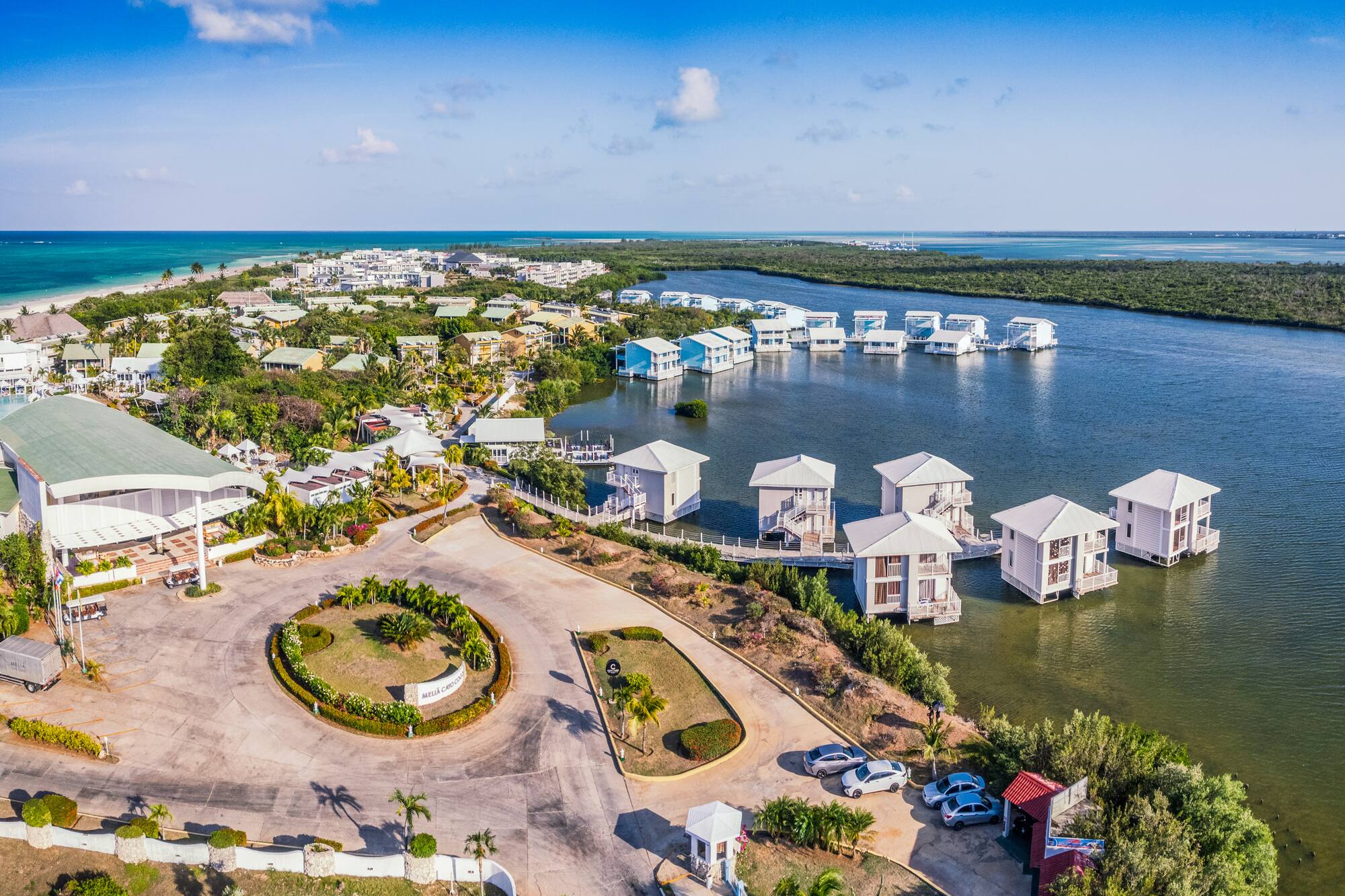 a aerial view of a body of water with houses and boats