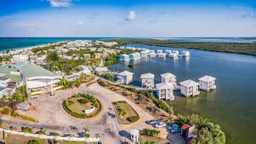 a aerial view of a body of water with houses and boats