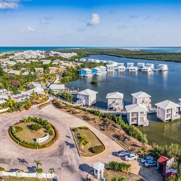 a aerial view of a body of water with houses and boats