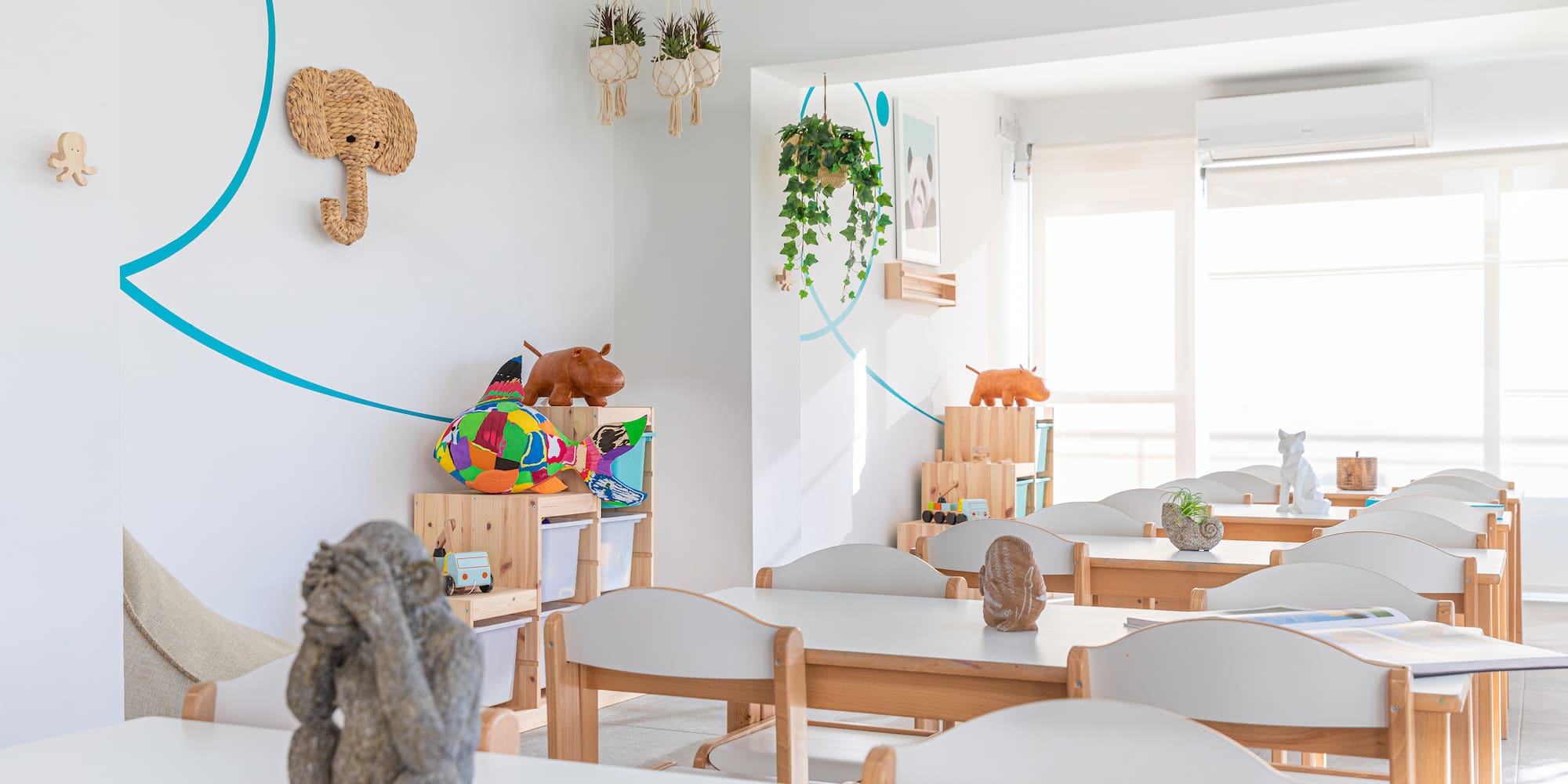 a room with white tables and chairs
