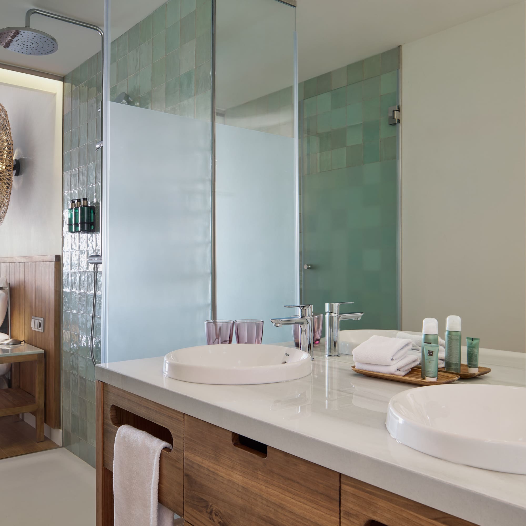 a bathroom with a shower and sink