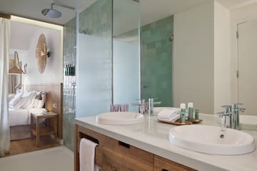 a bathroom with a shower and sink
