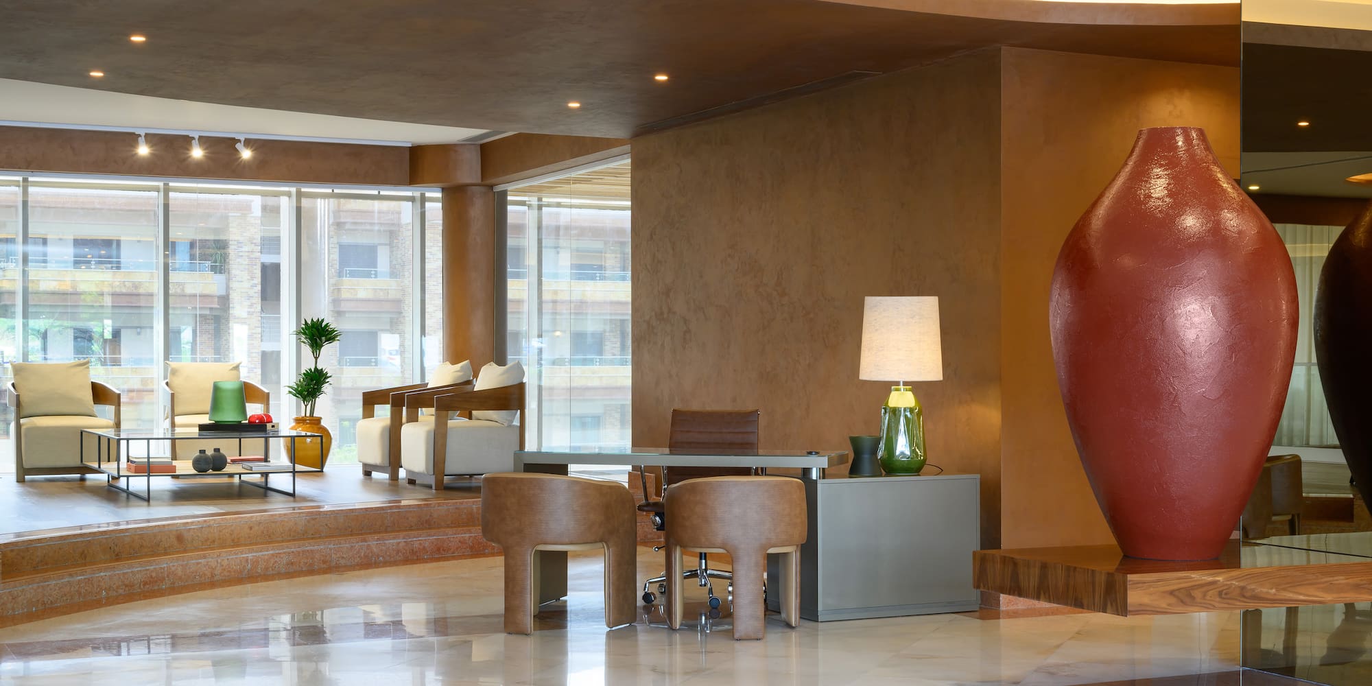 a room with a large vase and a table