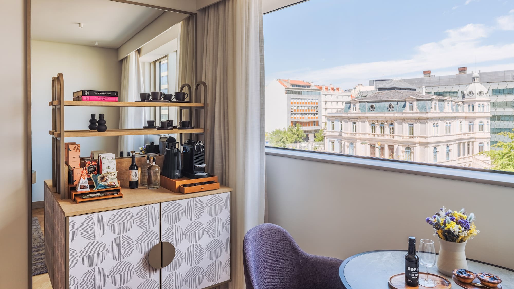 a room with a table and chairs and a window