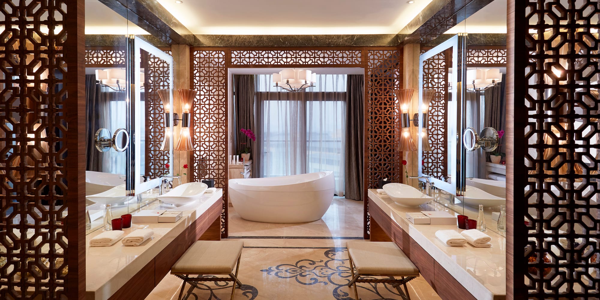 a bathroom with a tub and sinks